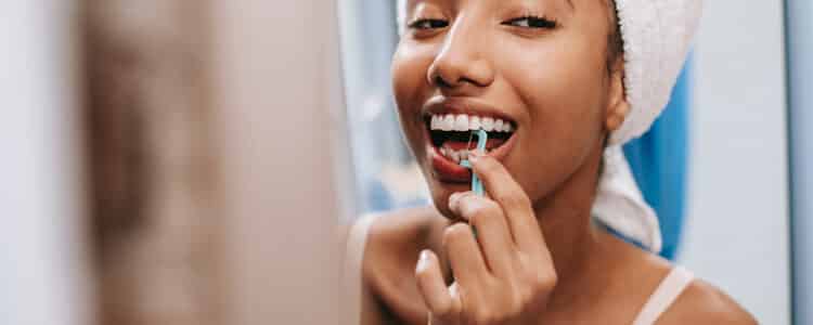 Woman Flossing | Gum Issues